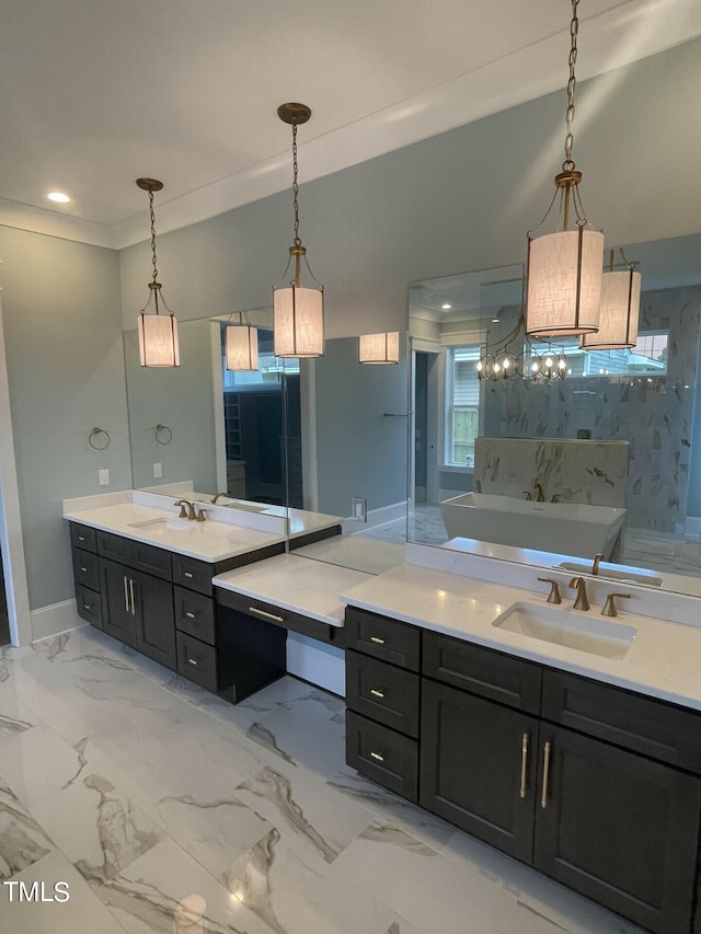 bathroom with a tub to relax in, vanity, and crown molding