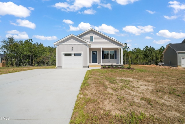 view of front facade with a garage and a front lawn