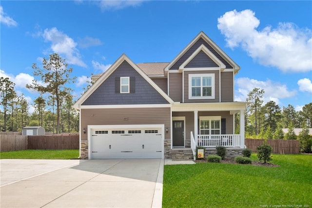 craftsman inspired home with a front yard and a porch