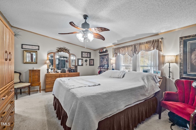 bedroom featuring a textured ceiling, light colored carpet, ceiling fan, and ornamental molding