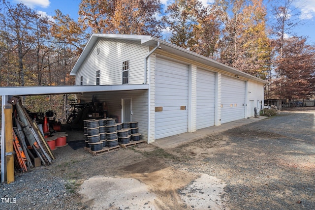 garage featuring a carport