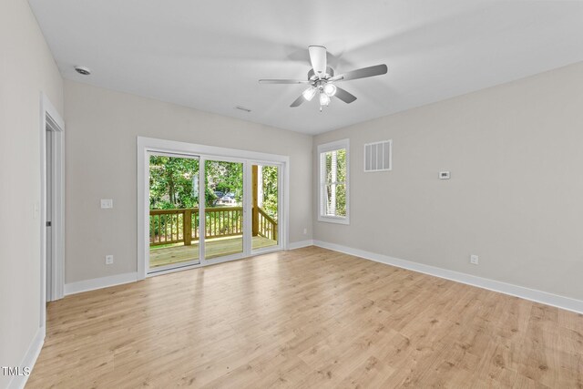 empty room with light wood-type flooring and ceiling fan