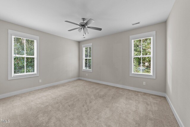 carpeted empty room with ceiling fan