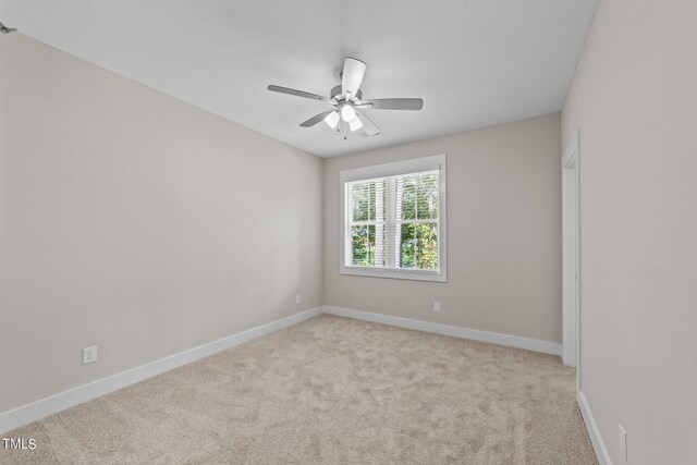 empty room with light carpet and ceiling fan