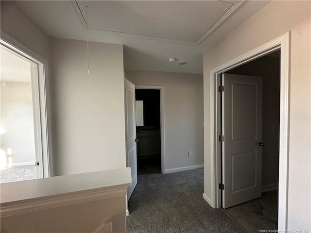 hallway featuring dark colored carpet