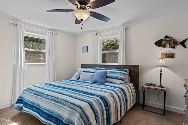 carpeted bedroom featuring ceiling fan and ornamental molding