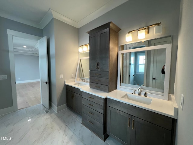 bathroom with vanity and crown molding