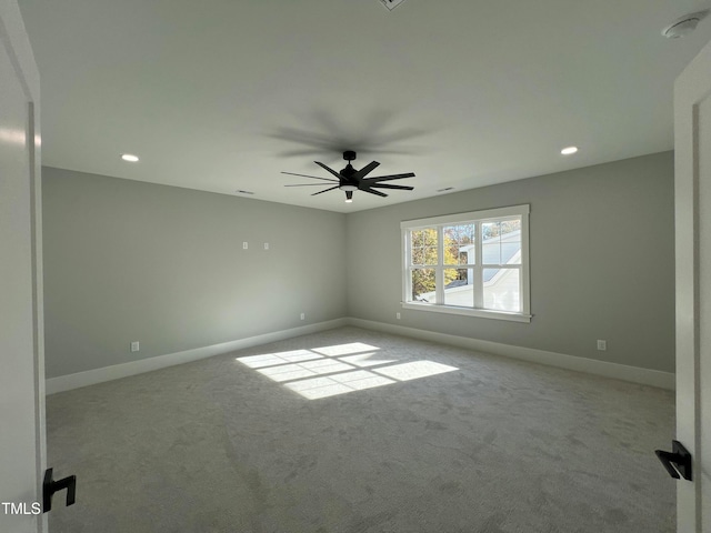 carpeted empty room featuring ceiling fan