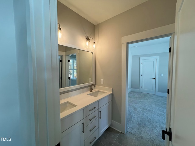 bathroom with tile patterned floors and vanity