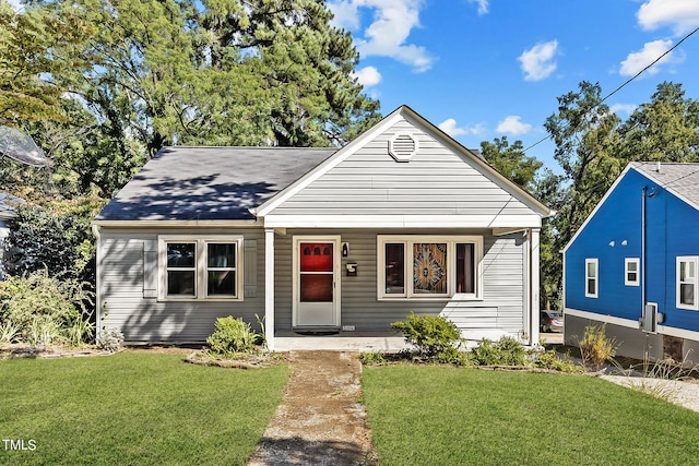 bungalow with a front yard