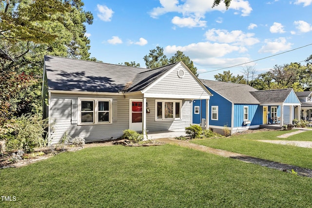 ranch-style home with a front yard