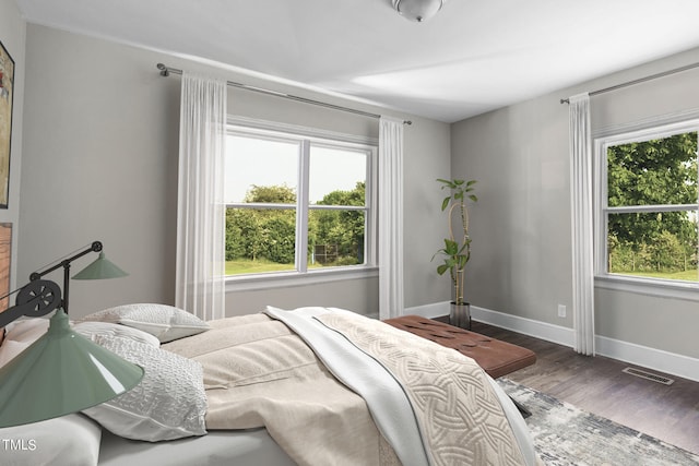 bedroom featuring dark hardwood / wood-style flooring