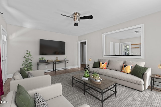 living room featuring light wood-type flooring and ceiling fan