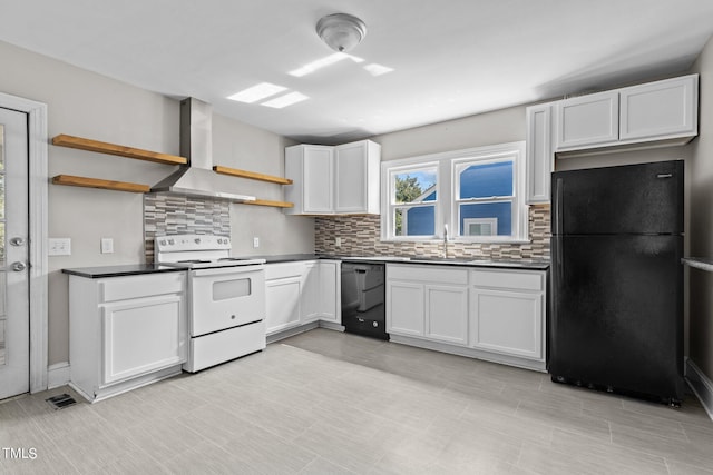 kitchen with decorative backsplash, white cabinetry, wall chimney range hood, and black appliances