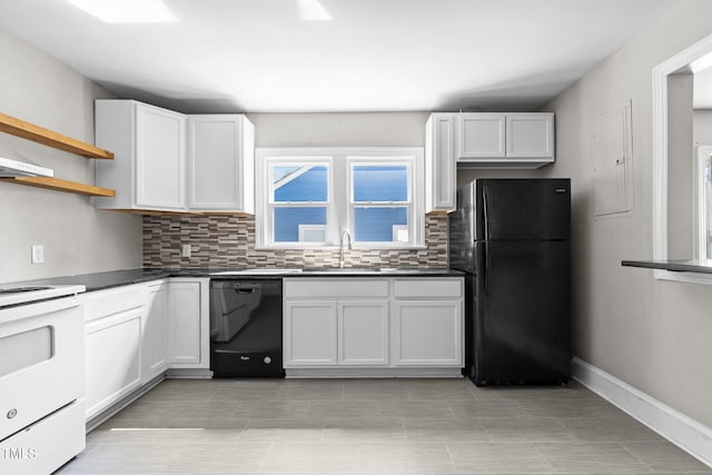 kitchen with white cabinets, sink, tasteful backsplash, and black appliances