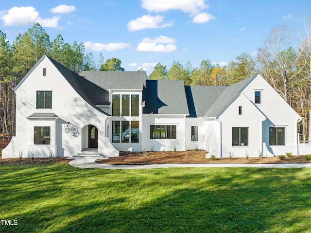 modern farmhouse style home with a front yard