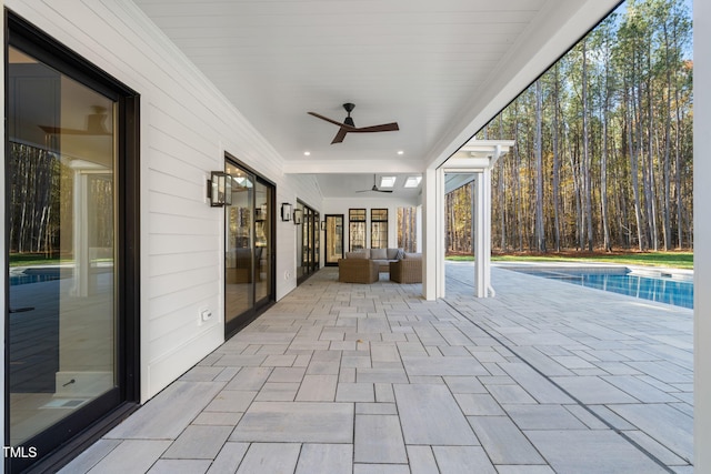 view of patio / terrace featuring an outdoor living space and ceiling fan