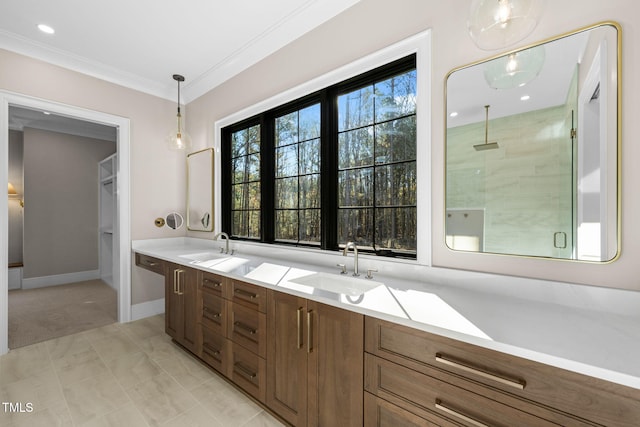 bathroom featuring vanity, tile patterned floors, a shower with shower door, and ornamental molding