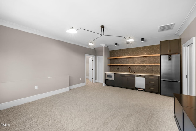 interior space featuring stainless steel fridge, white dishwasher, hanging light fixtures, and ornamental molding