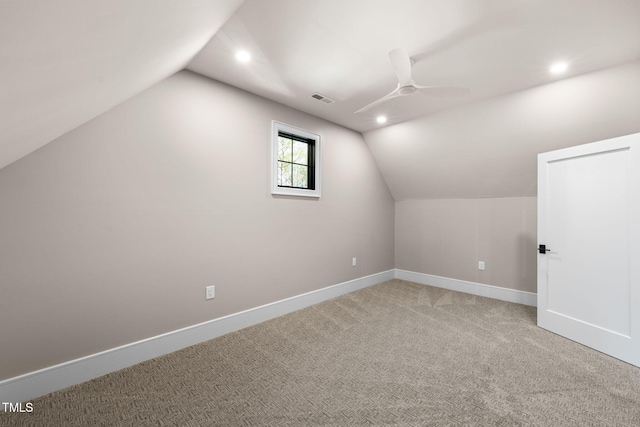 additional living space with ceiling fan, carpet, and lofted ceiling