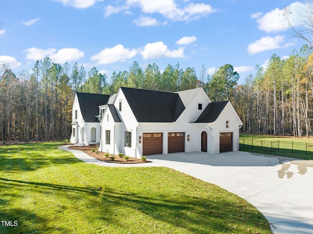 view of front of house featuring a front yard and a garage