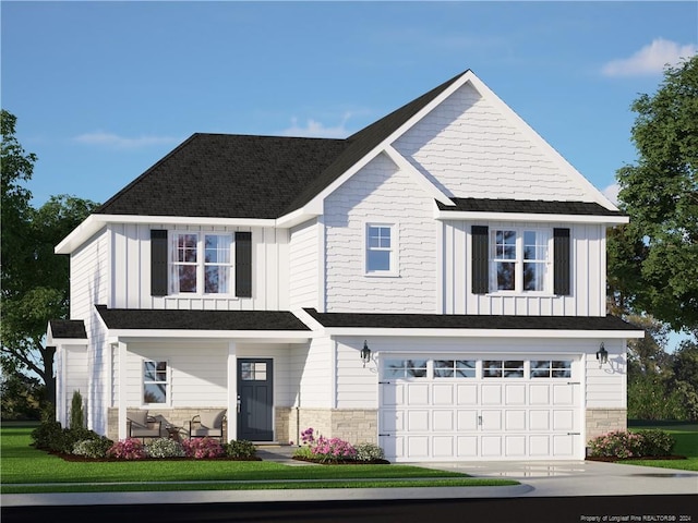 view of front of home featuring a garage and a front yard