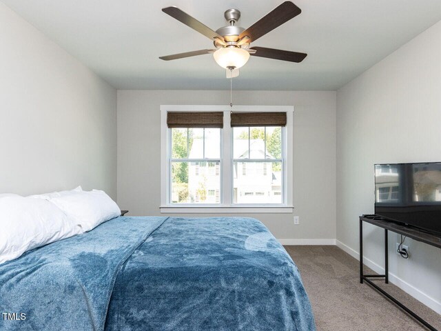 carpeted bedroom with ceiling fan