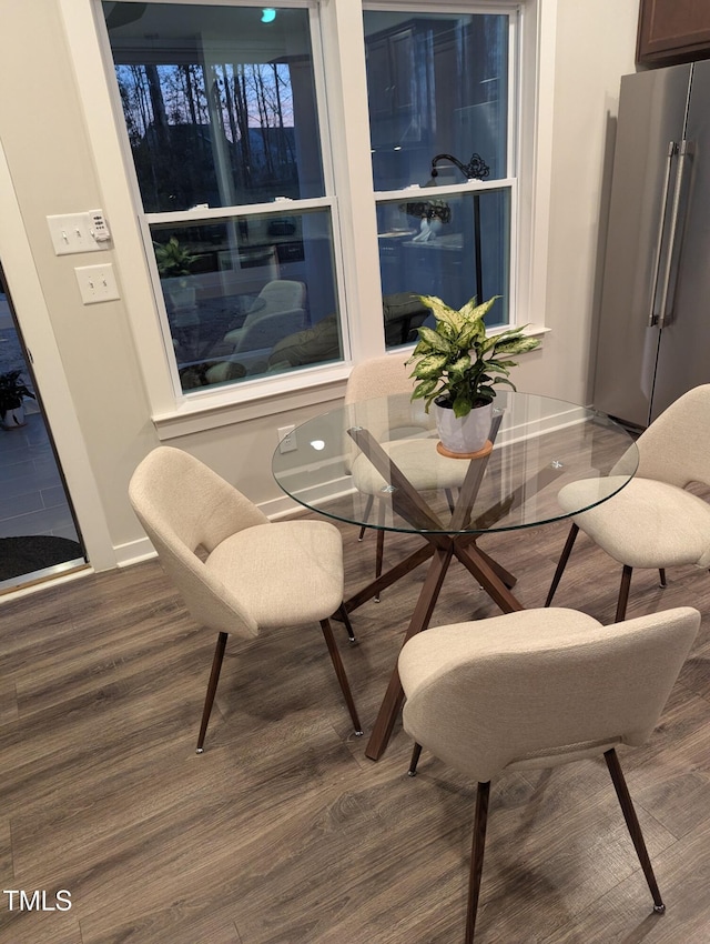 dining space featuring dark hardwood / wood-style flooring