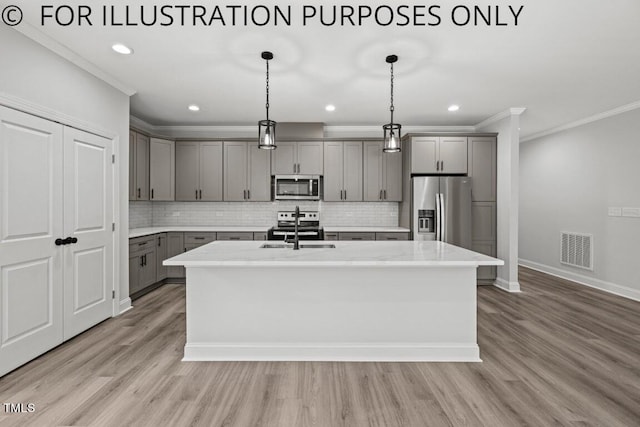 kitchen with visible vents, light wood finished floors, gray cabinets, a sink, and appliances with stainless steel finishes