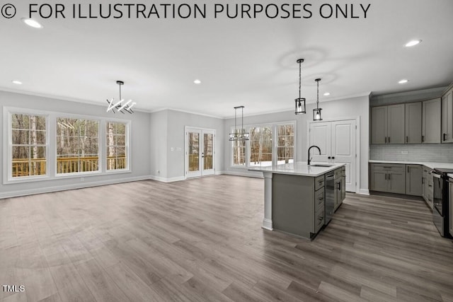 102 Mayan Dr, Louisburg, NC 27549 - kitchen with a sink, light countertops, a chandelier, and gray cabinetry