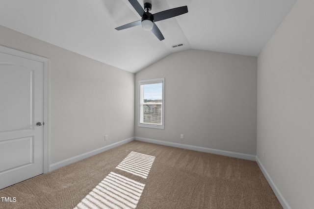 unfurnished room with lofted ceiling, ceiling fan, and light carpet