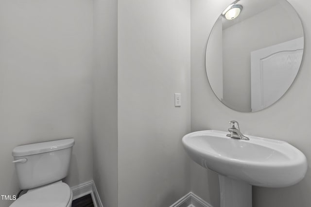 bathroom with toilet and sink