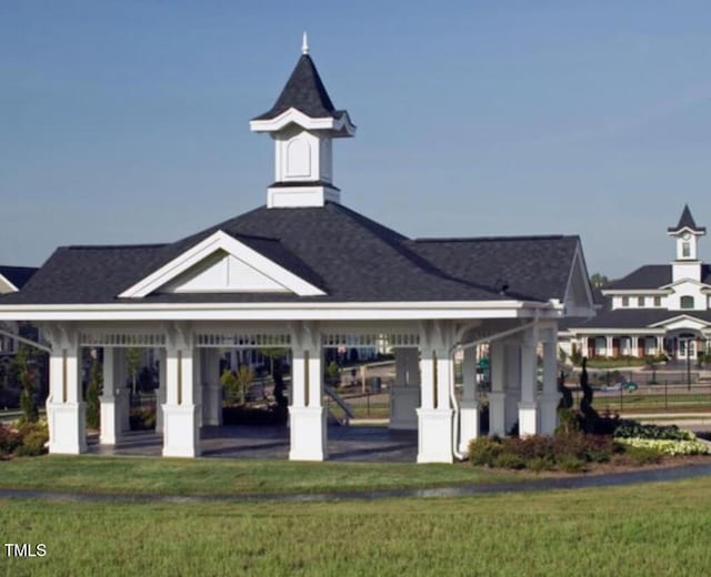 view of home's community with a gazebo and a yard