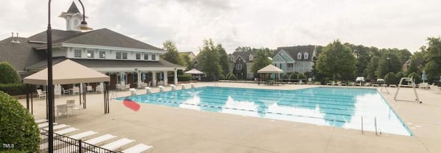 community pool featuring a patio area
