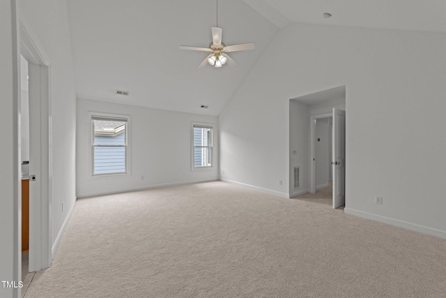 unfurnished room with high vaulted ceiling, baseboards, a ceiling fan, and visible vents