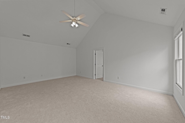 empty room featuring light colored carpet, ceiling fan, and visible vents