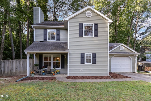 front of property with a garage and a front yard