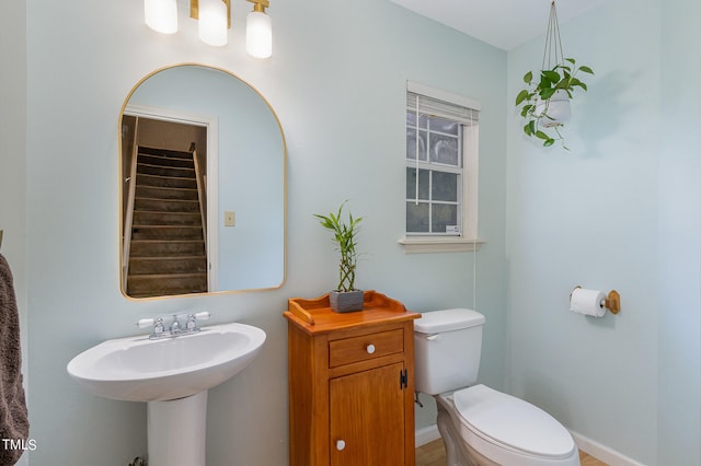 bathroom with toilet and sink