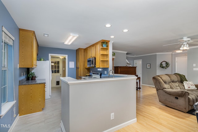 kitchen featuring ceiling fan, white range with electric cooktop, light hardwood / wood-style floors, and kitchen peninsula