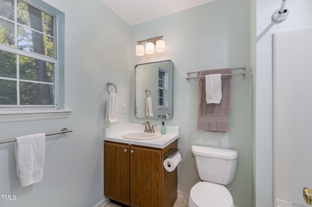 bathroom with toilet and vanity