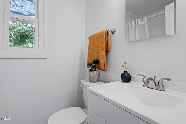 bathroom with vanity and toilet