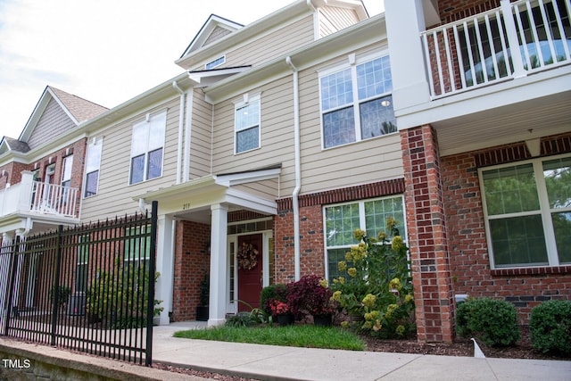 view of front of property with a balcony