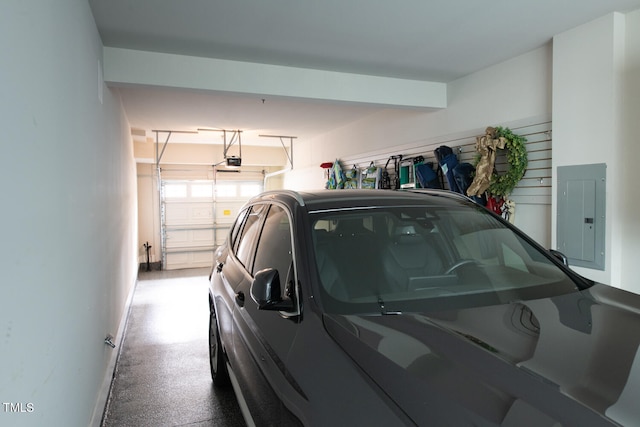 garage featuring a garage door opener and electric panel