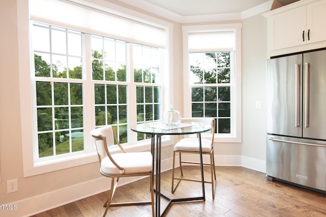 dining space with light hardwood / wood-style flooring