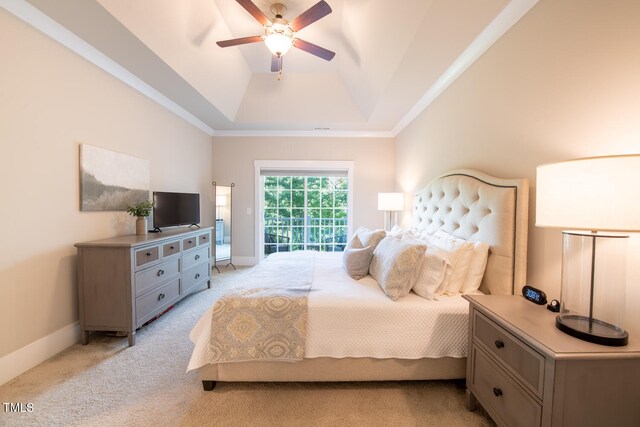 bedroom featuring a tray ceiling, light carpet, access to exterior, and ceiling fan