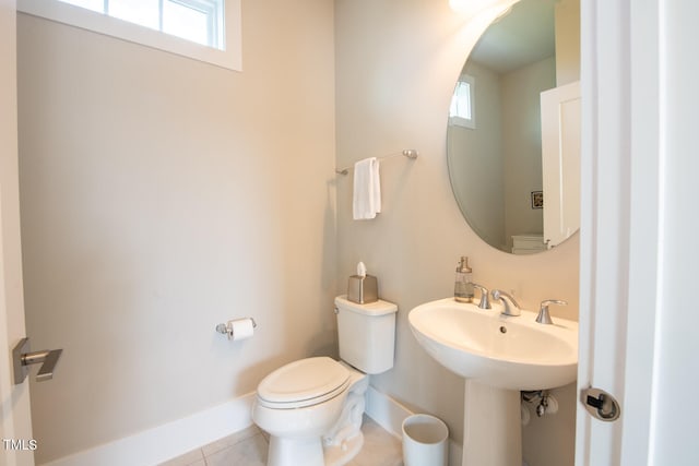 bathroom featuring tile patterned flooring and toilet