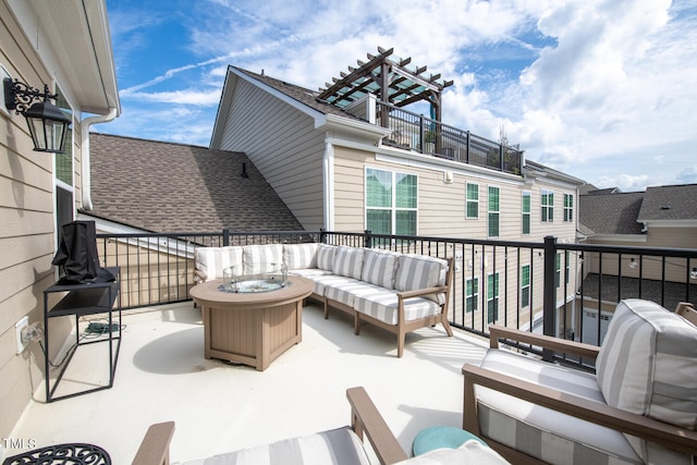 exterior space with an outdoor living space with a fire pit