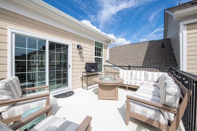 view of patio featuring an outdoor living space with a fire pit and area for grilling