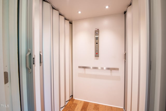 bathroom with hardwood / wood-style flooring