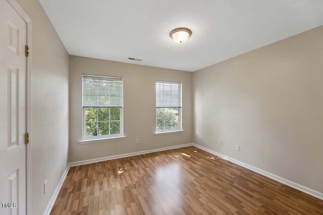 empty room featuring hardwood / wood-style floors